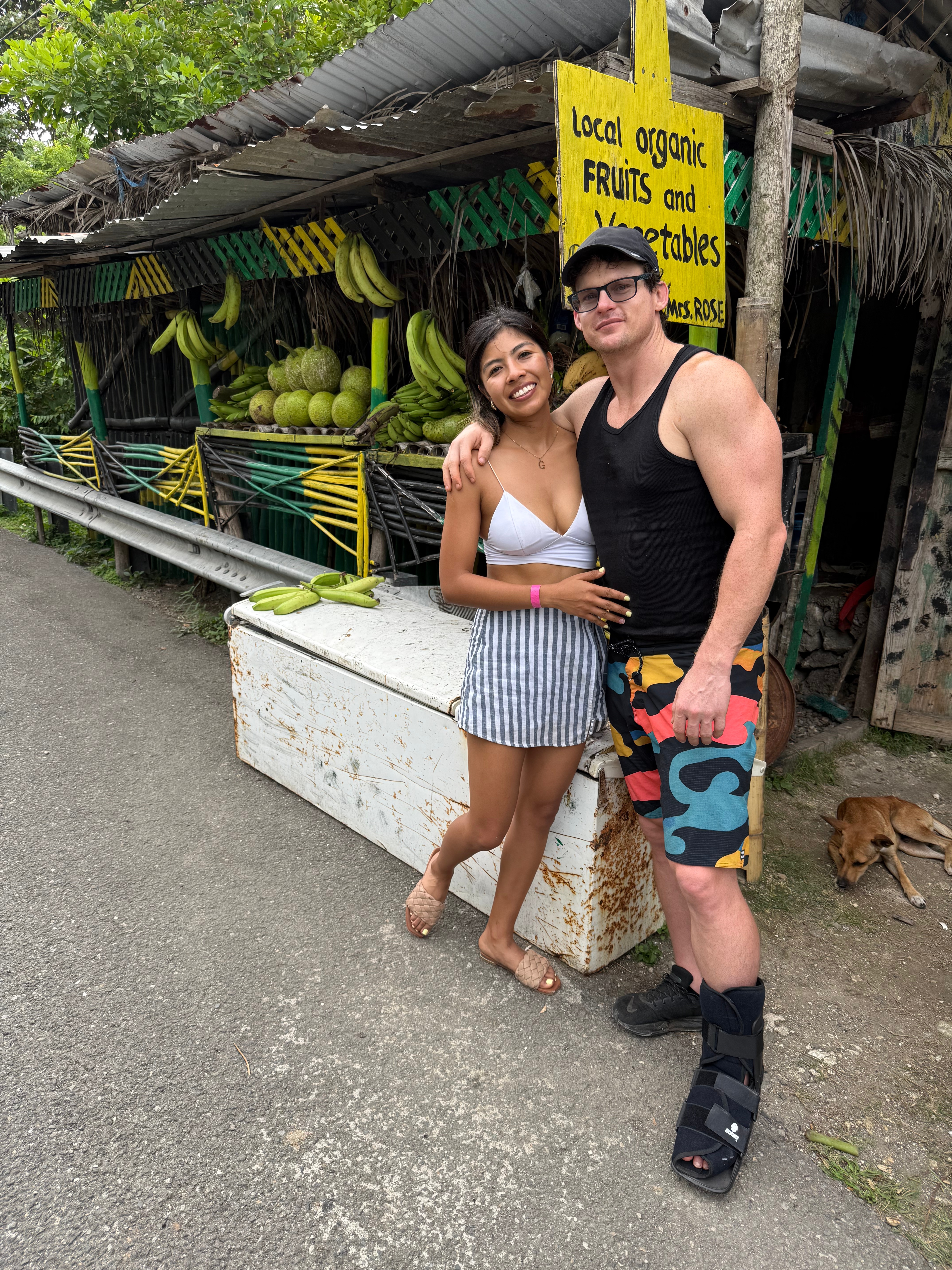 In front of fruit stand in Jamaica